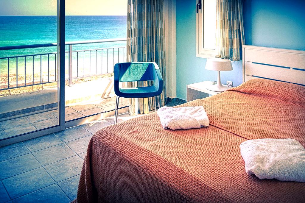 Luxury hotel room interior with large window viewing nature